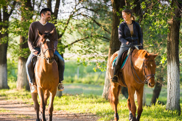 Couple on Horseback going through Killarney National Park