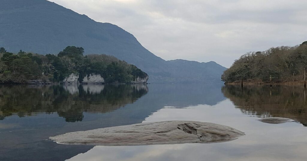 View of Muckross lake of a cloudy day from the shores of Dundag