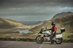 Man on Motorbike parked by the viewing point at Ladies View