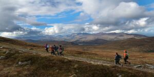 People walking up Mangerton Mountain