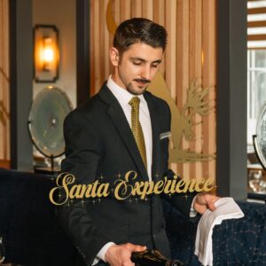 Santa Experience main image. Man pouring wine